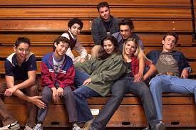 A group of people sitting on a couch
Description automatically generated with medium confidence