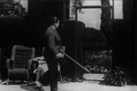 EASY VIRTUE (1928) Twenty one minutes in, Alfred Hitchcock walks past a tennis court carrying a stick. | Hitchcock, Alfred hitchcock movies, Alfred hitchcock